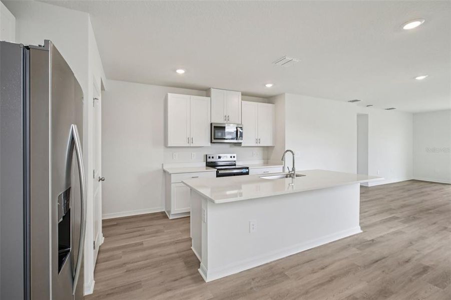 Furnished interior view inside a new home in Two Rivers - Premier Series, Zephyrhills (Image 5). Furnished interior view inside a new home in Two Rivers - Premier Series, Zephyrhills (Image 5).