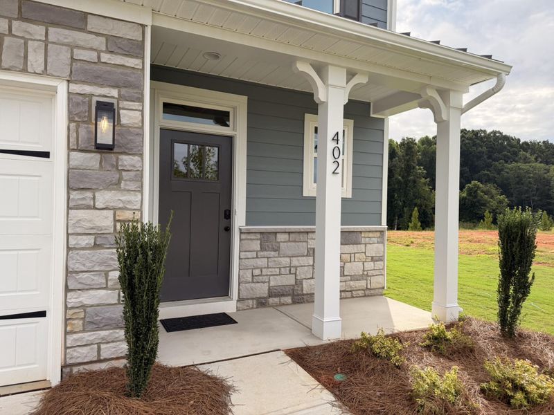 Exterior details and patio area of a home in Blythe Mill Townhomes, Waxhaw (Image 2).