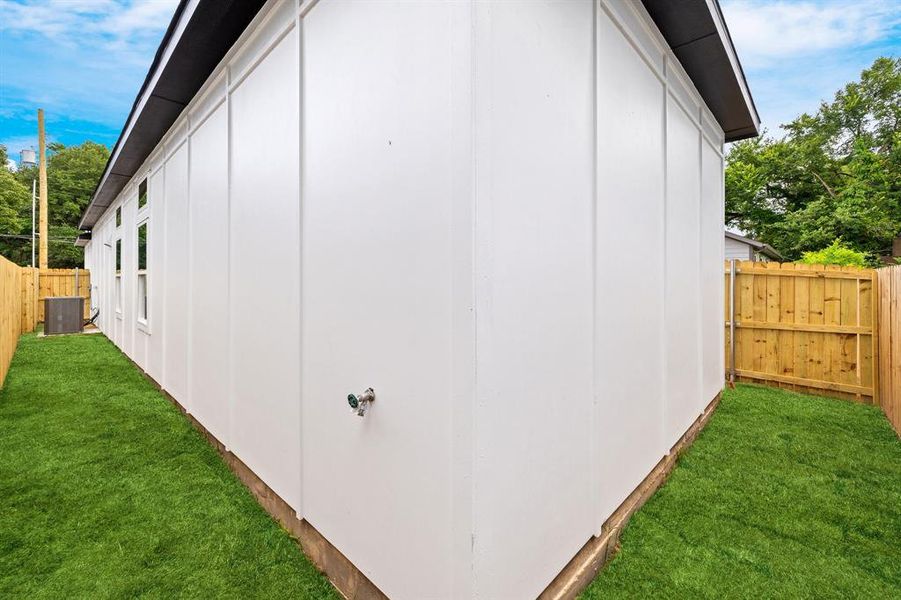 View of outdoor structure with a fenced backyard