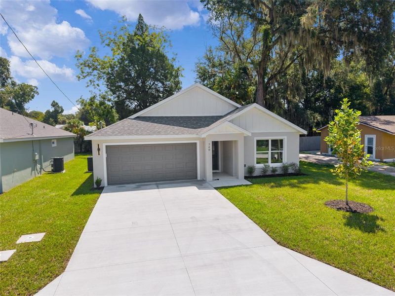 Front exterior of a new home in , Wildwood, FL, highlighting curb appeal (Image 21).