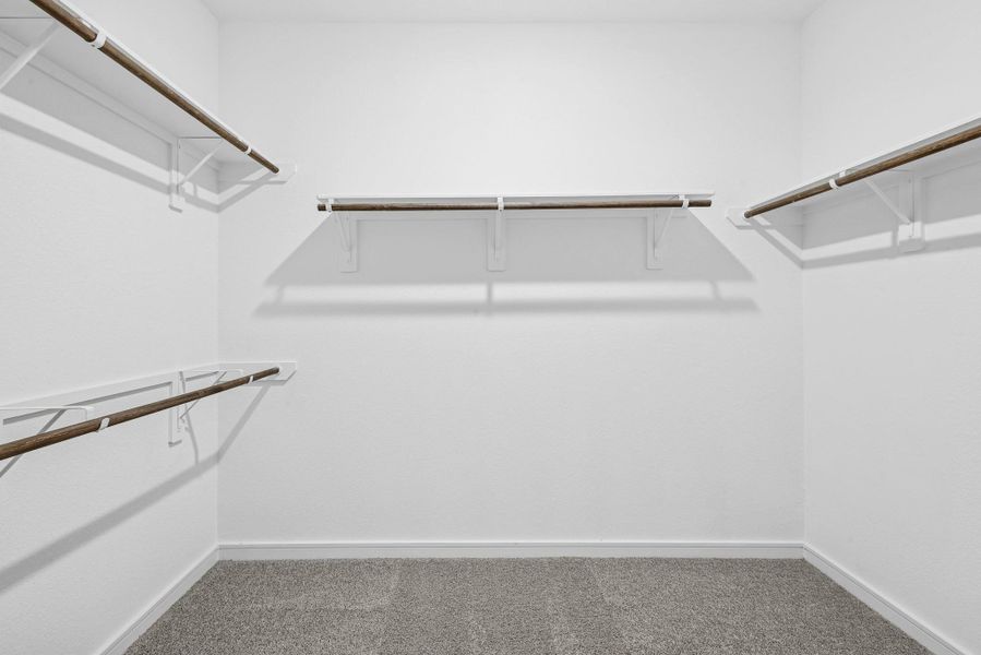 Primary walk-in closet Primary walk-in closet