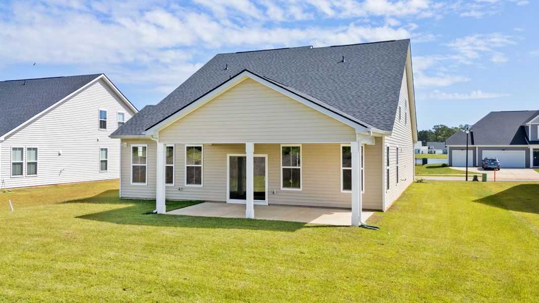 Spacious rear exterior with a covered porch, perfect for outdoor living in Chestnut Farms.