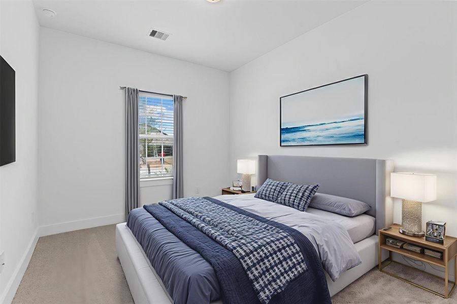 Just off the entry, this versatile guest bedroom offers plush carpet, a bright window with natural light, and neutral tones—perfect for visitors, a nursery, or additional flex space. *Virtually Staged* **Image Representative of Plan Only and May Vary as Built**.