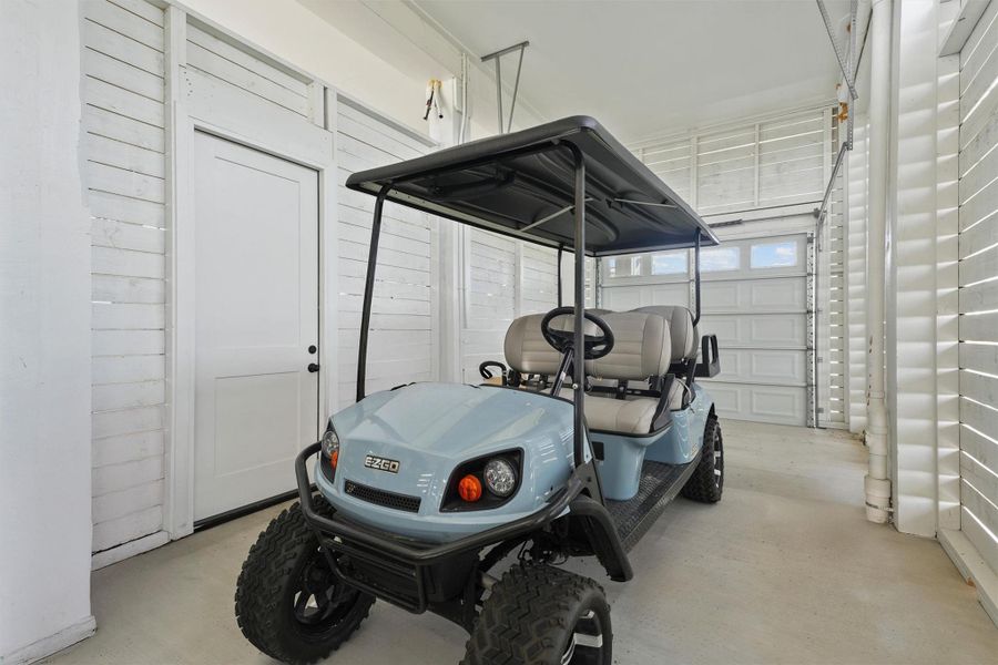 Oversized golf cart garage can easily be converted with a taller door for RV or Boat parking. EZ Go Golf cart conveys with the sale and can provide easy access via the golf cart pathways throughout the community to the Beach Club, Pools and Beach Crossovers.