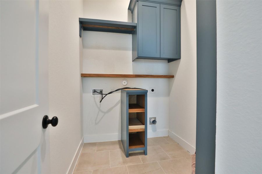 The utility room is conveniently located next to the primary suite and includes added storage for extra functionality and organization. The utility room is conveniently located next to the primary suite and includes added storage for extra functionality and organization.