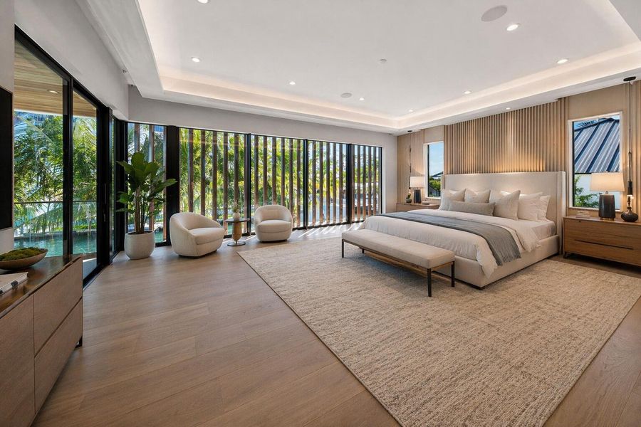 Modern airy bedroom with waterfront view