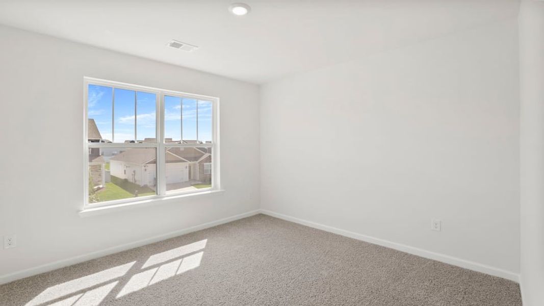 Spacious, unfurnished interior of a new home in Durbin Meadows Traditions, Fountain Inn (Image 26).