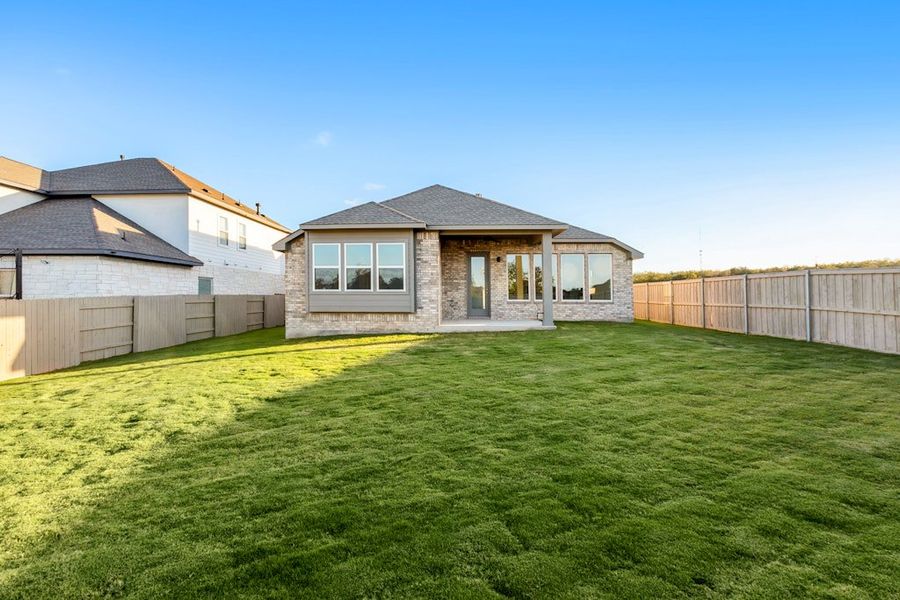 Exterior details and patio area of a home in The Colony, Bastrop (Image 20).
