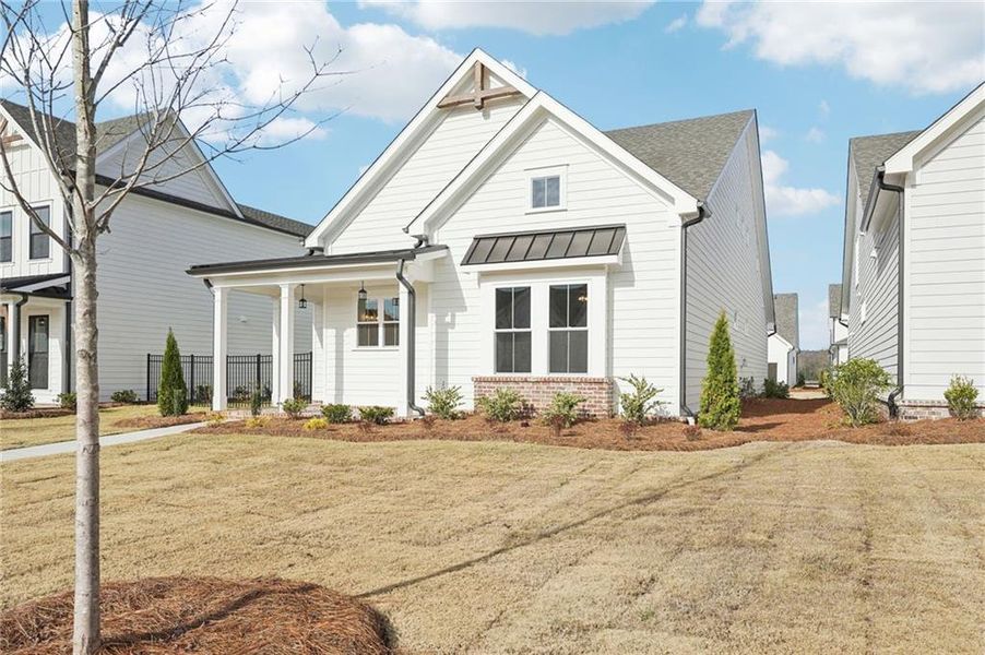 Front exterior of a new home in Promenade at Sawnee Village, Cumming, GA, highlighting curb appeal (Image 30).