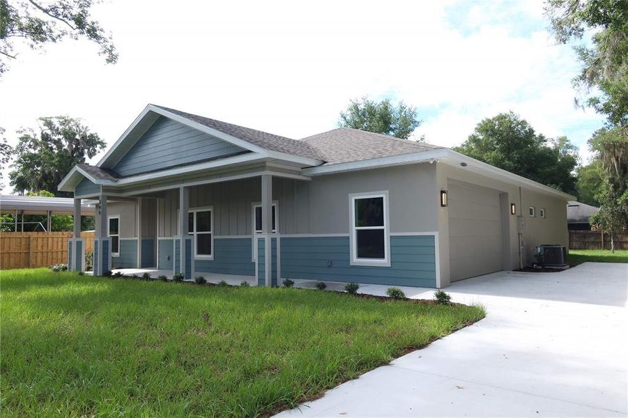 Front exterior of a new home in , Lake Helen, FL, highlighting curb appeal (Image 24).
