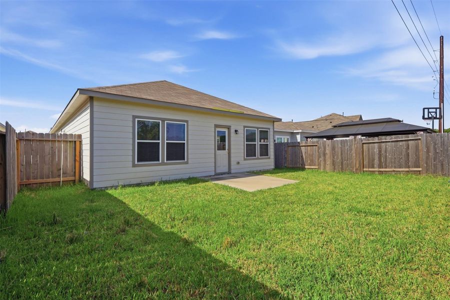 Exterior details and patio area of a home in Barrett Crossing, Crosby (Image 3).