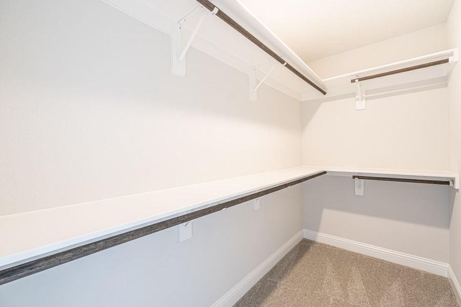 Primary walk in closet Primary walk in closet