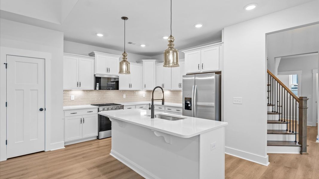 Notable 9-foot island provides generous space in this thoughtfully designed kitchen at Silo Ridge in Anderson, SC