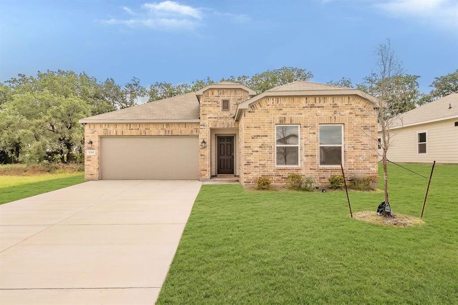 Front exterior of a new home in Courtland Place, Cleburne, TX, highlighting curb appeal (Image 2). Front exterior of a new home in Courtland Place, Cleburne, TX, highlighting curb appeal (Image 2).