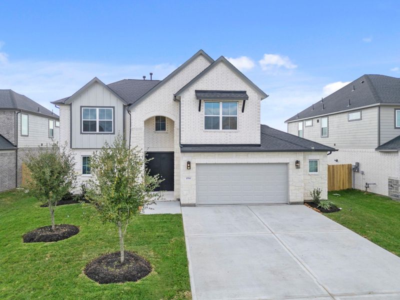 Front exterior of a new home in Briarwood Crossing, Rosenberg, TX, highlighting curb appeal (Image 21).