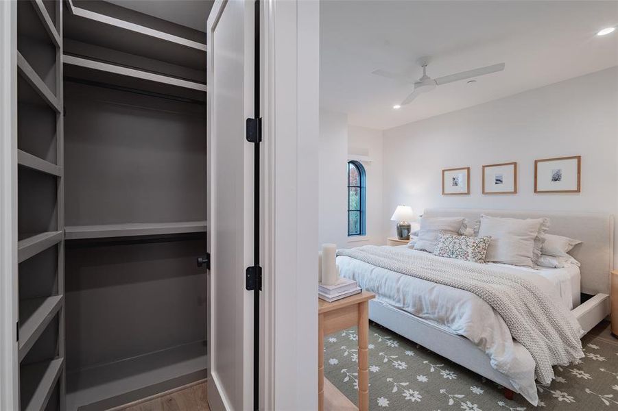 Bedroom featuring ceiling fan and wood-type flooring