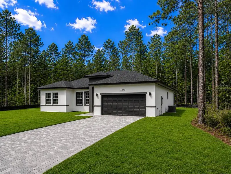 Front exterior of a new home in , Ocala, FL, highlighting curb appeal (Image 19).