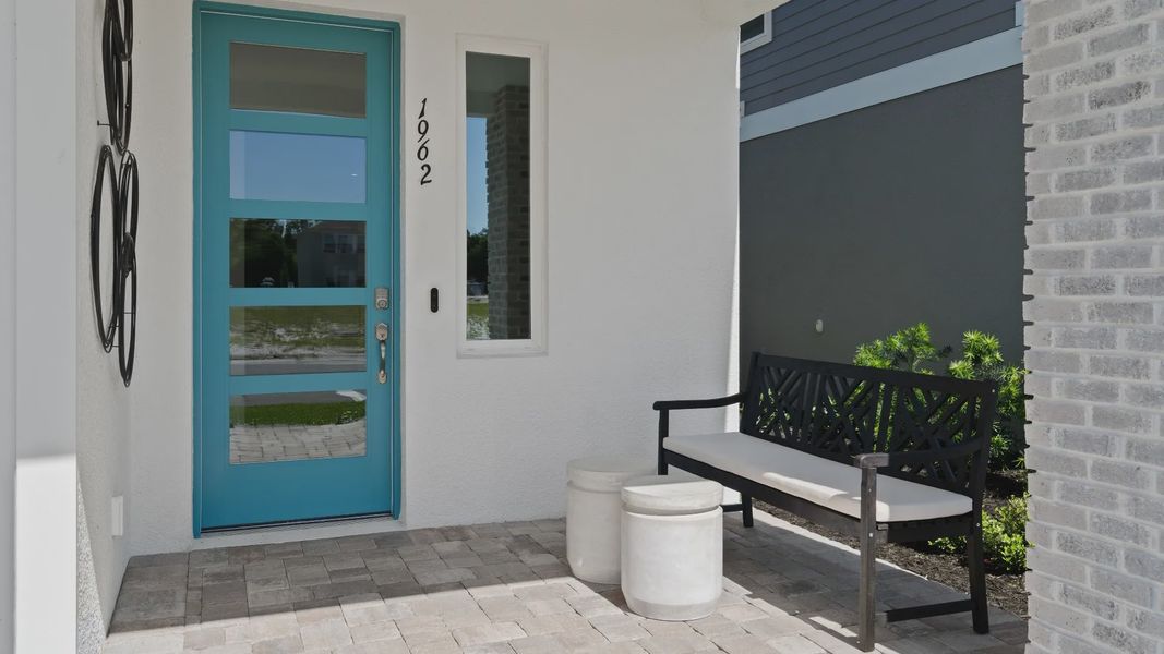 Outside covered entry at a DRB Homes Ambersweet model at the Trinity Place community. Outside covered entry at a DRB Homes Ambersweet model at the Trinity Place community.