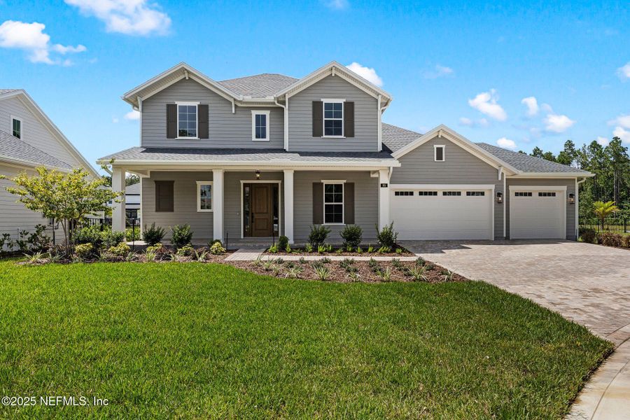Front exterior of a new home in , St. Johns, FL, highlighting curb appeal (Image 19). Front exterior of a new home in , St. Johns, FL, highlighting curb appeal (Image 19).