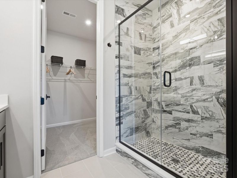 Modern Tile Design at Semi Frameless Primary Shower. Modern Tile Design at Semi Frameless Primary Shower.