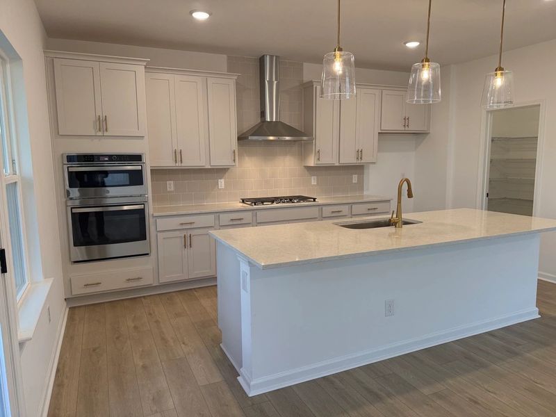 Kitchen featuring the AW Collection® Serene - Clean lines and earthy textures define the space.