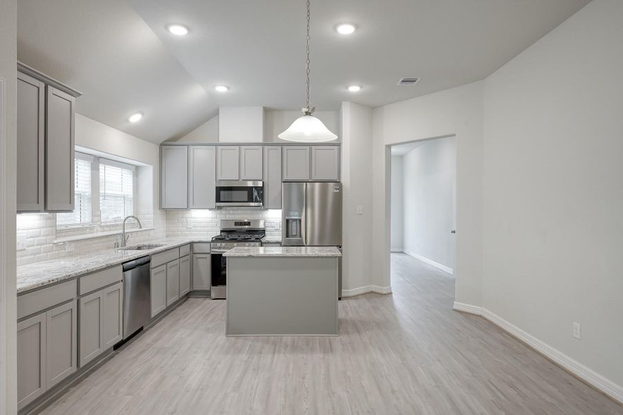 Island kitchen with plenty of counter space and storage