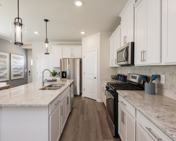 The large kitchen counter gives you ample space to prep dinner.