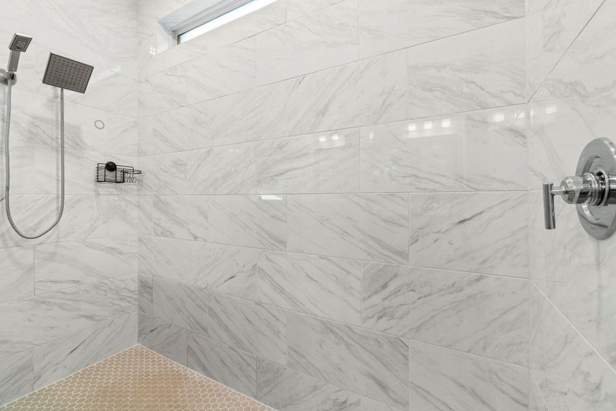 Master Bath features dual vanities and a spa-like mud set shower of your dreams!