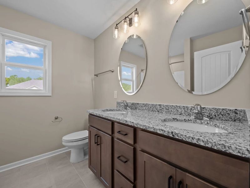 Representative furnished interior of a home built from the Mason A by JC Jackson Homes,LLC in Heritage Pointe, Newport (Image 5).
