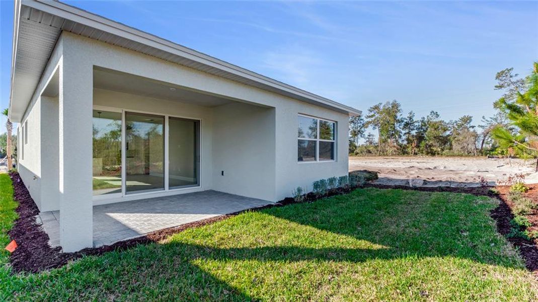 Exterior details and patio area of a home in Cresswind DeLand, Deland (Image 15).