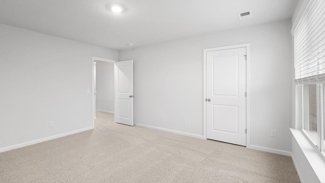 Spacious, unfurnished interior of a new home in Pine Hills at Cane Bay, Summerville (Image 9).