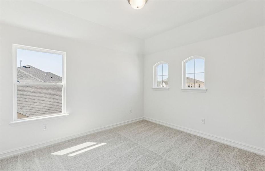 Spacious secondary bedroom with large windows Spacious secondary bedroom with large windows