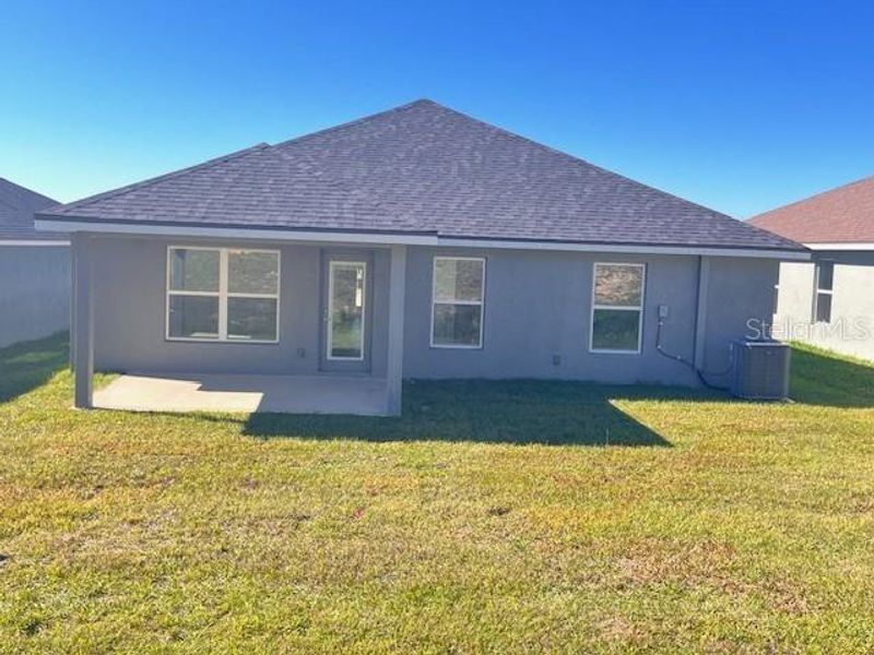 Exterior details and patio area of a home in Abbey Glen, Dade City (Image 2).