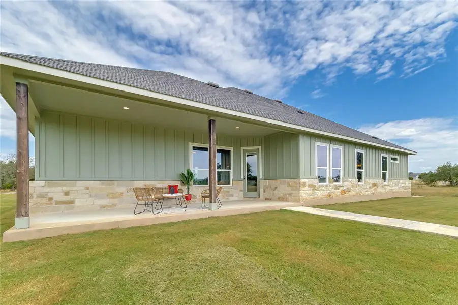 Front exterior of a new home in , Bertram, TX, highlighting curb appeal (Image 1).