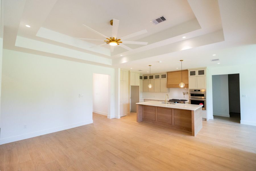 Custom boxed ceilings ranging from 10-12 feet in the living room, dining room and primary suite.