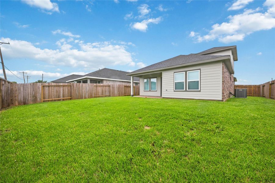Spacious backyard — Large fenced backyard with plenty of room for play and outdoor activities. Spacious backyard — Large fenced backyard with plenty of room for play and outdoor activities.