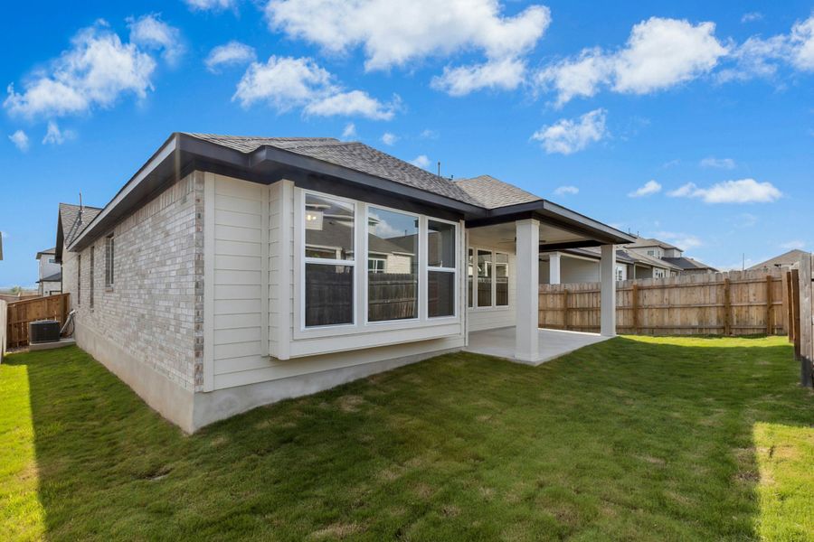 Exterior details and patio area of a home in University Heights, Round Rock (Image 18).