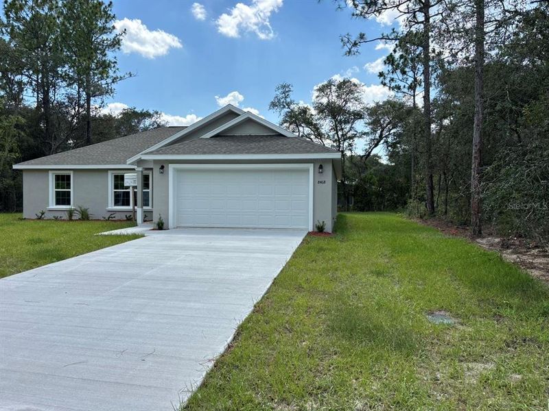 Front exterior of a new home in , Dunnellon, FL, highlighting curb appeal (Image 2). Front exterior of a new home in , Dunnellon, FL, highlighting curb appeal (Image 2).
