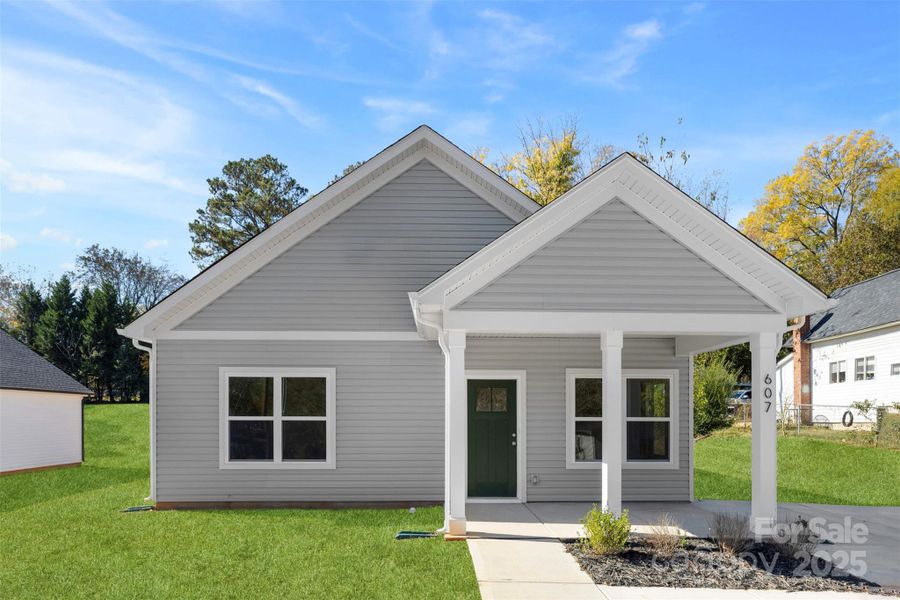 Front exterior of a new home in , Spencer, NC, highlighting curb appeal (Image 18).