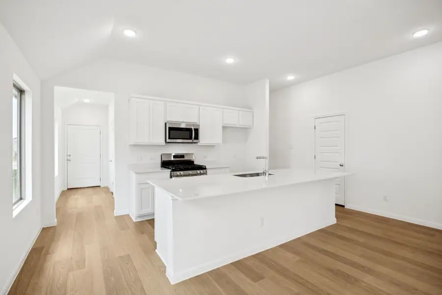 Kitchen in the Spruce home plan by Trophy Signature Homes - REPRESENTATIVE PHOTO