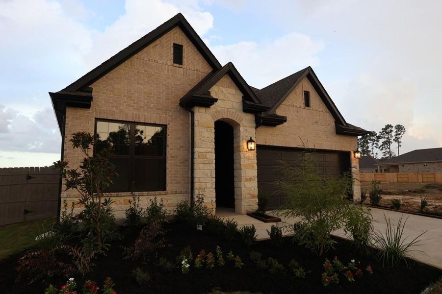 Front exterior of a new home in ARTAVIA 45' Homesites, Conroe, TX, highlighting curb appeal (Image 24).