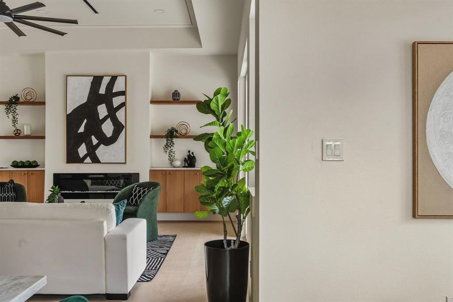 Living room featuring a ceiling fan