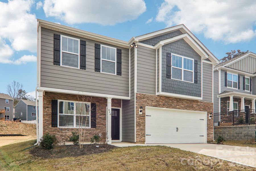 Front exterior of a new home in Rydele Heights, Asheville, NC, highlighting curb appeal (Image 2). Front exterior of a new home in Rydele Heights, Asheville, NC, highlighting curb appeal (Image 2).