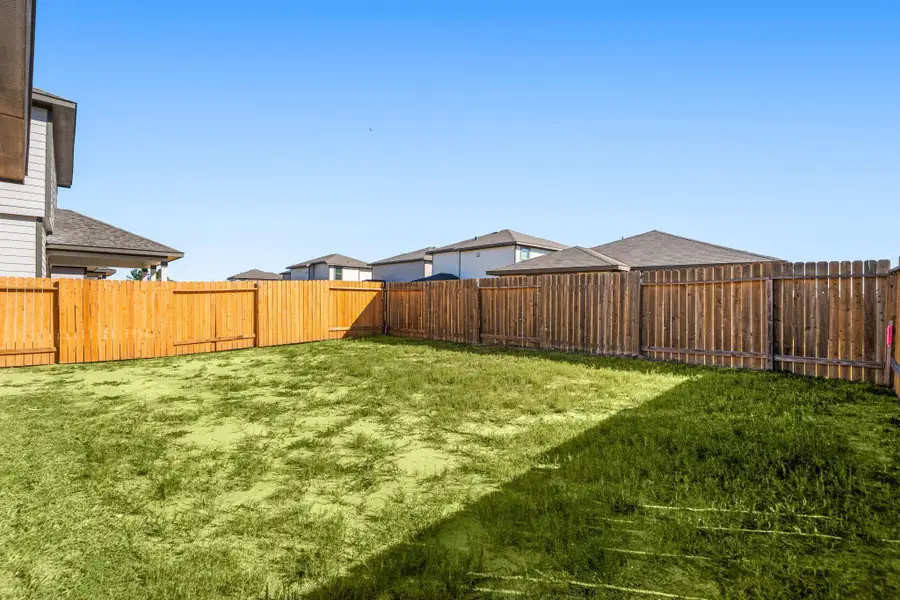 A generous backyard offering endless possibilities, from creating your dream garden to adding a play area or outdoor living space. The wide, fenced lot provides both privacy and plenty of room to enjoy the outdoors in comfort. A generous backyard offering endless possibilities, from creating your dream garden to adding a play area or outdoor living space. The wide, fenced lot provides both privacy and plenty of room to enjoy the outdoors in comfort.