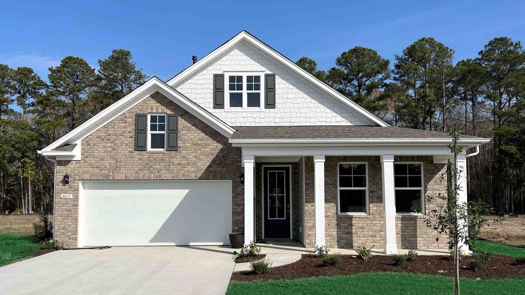 Representative exterior photo of a completed home built from the Darby by D.R. Horton in Brunswick Plantation, Ash, NC (Image 2). Representative exterior photo of a completed home built from the Darby by D.R. Horton in Brunswick Plantation, Ash, NC (Image 2).