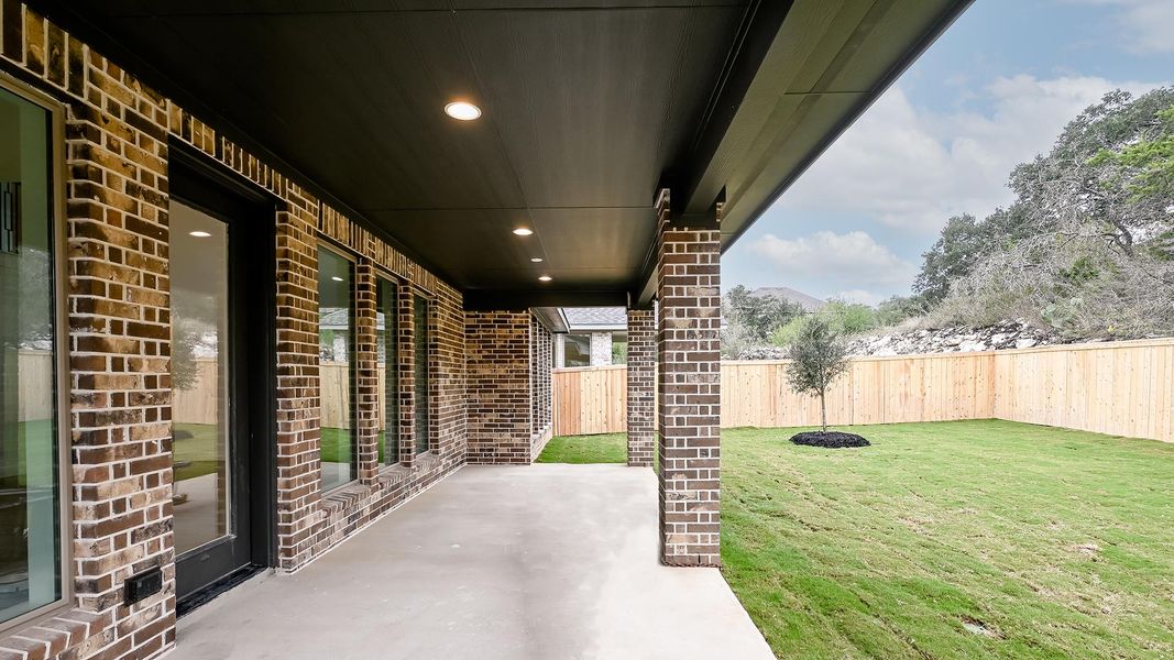 Exterior details and patio area of a home in Hidden Canyon 55', San Antonio (Image 3).