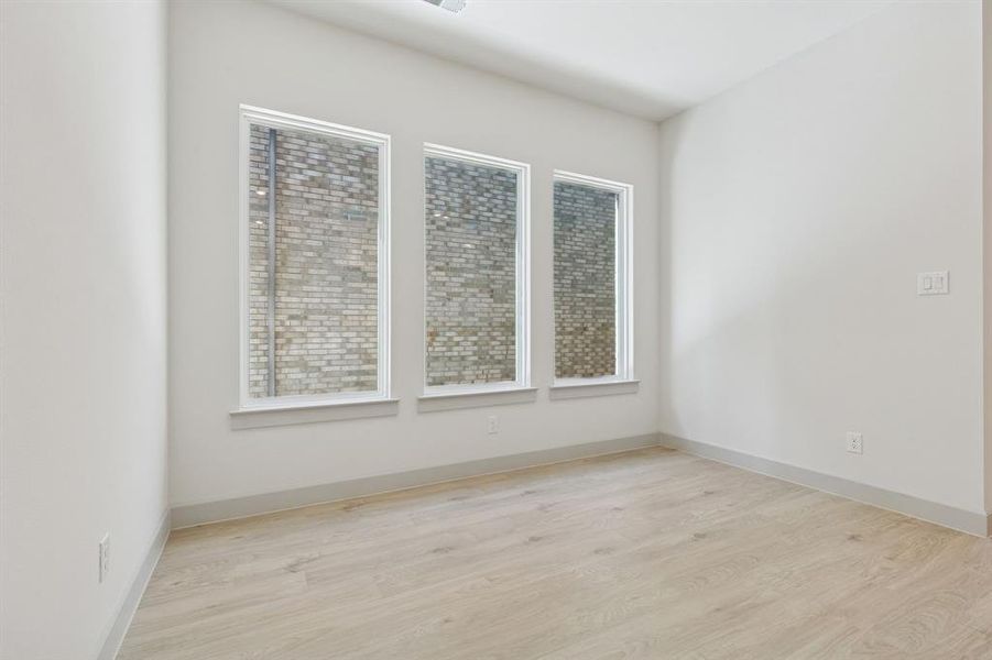 The light filled dining room is the perfect place to host lively dinner parties or cozy family meals.