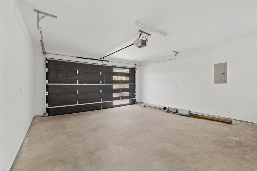 Garage with electric panel and a garage door opener Garage with electric panel and a garage door opener