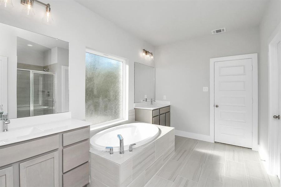 Discover another perspective of the spacious primary bathroom!