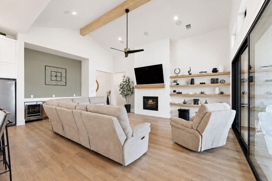 Oversized sliding doors seamlessly connect indoor and outdoor living, while surround sound creates the perfect atmosphere for entertaining or relaxing at home.